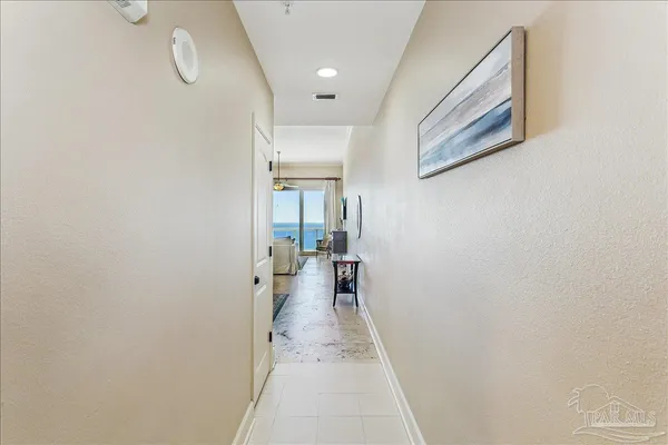 a kitchen with stainless steel appliances granite countertop a refrigerator a sink a stove and oven