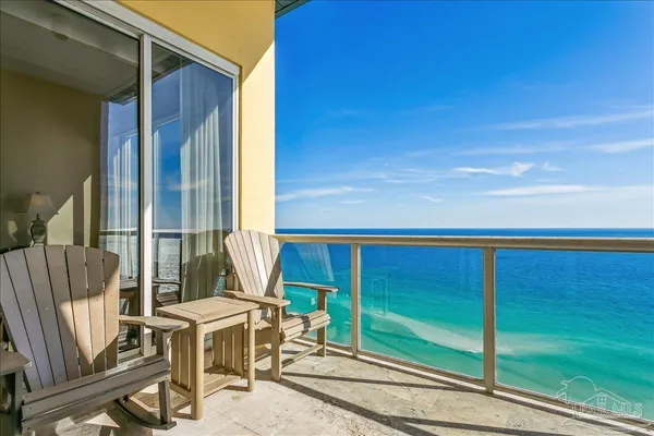 a view of balcony with two chairs