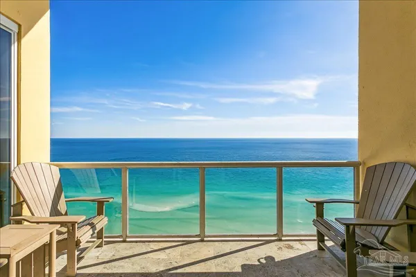 a living room with couches and pool view