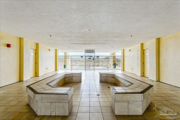a view of a balcony with two chairs and a table