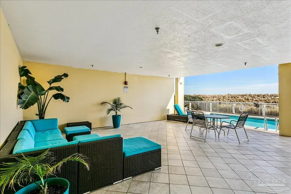 a view of roof deck with two chairs and wooden floor