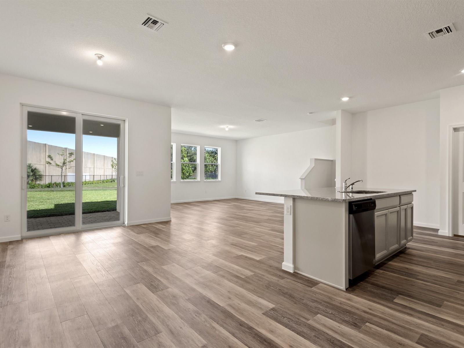 1927 Harding Street Lake Worth, FL 33460 - Photo 2 of 19 an empty room with wooden floor and entrance