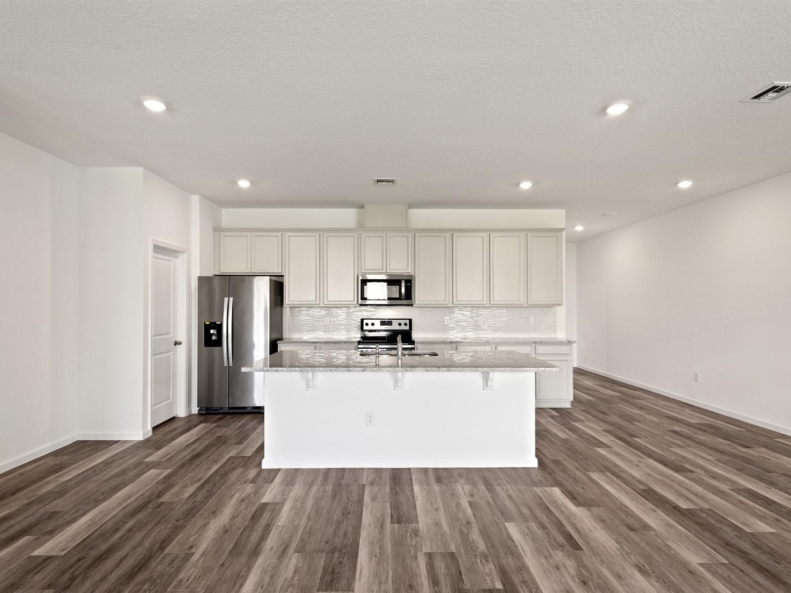 1927 Harding Street Lake Worth, FL 33460 - Photo 4 of 19 a view of kitchen with wooden floor