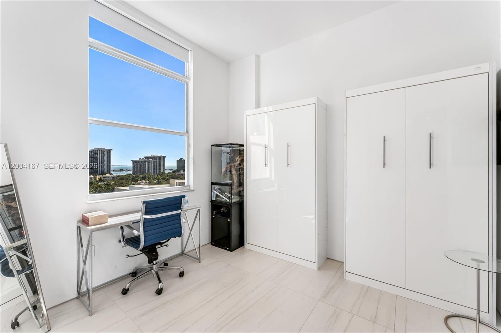 1723 Southwest 2nd Avenue, Unit PH2 Miami, FL 33129 - Photo 12 of 18 a view of workspace with furniture and wooden floor