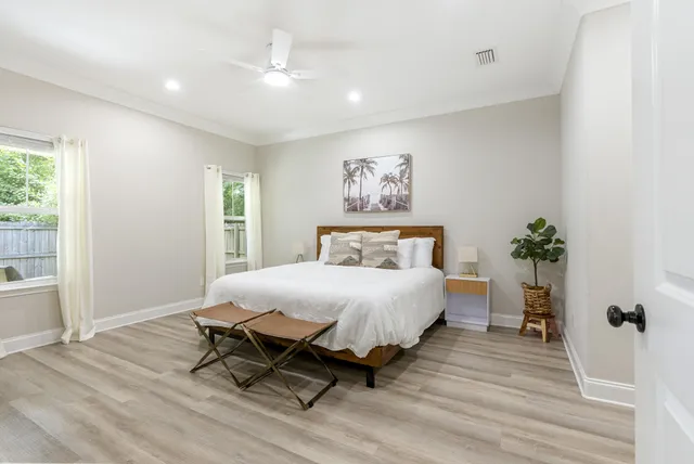 a bedroom with a bed and a window