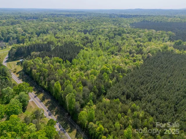 a view of a field with an ocean