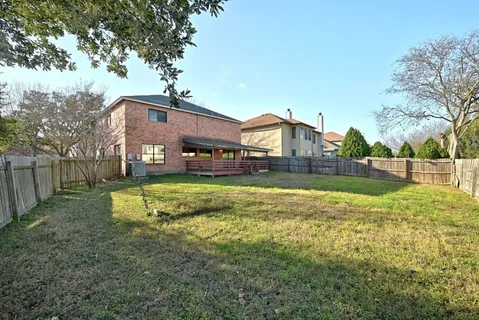 a view of a house with a big yard