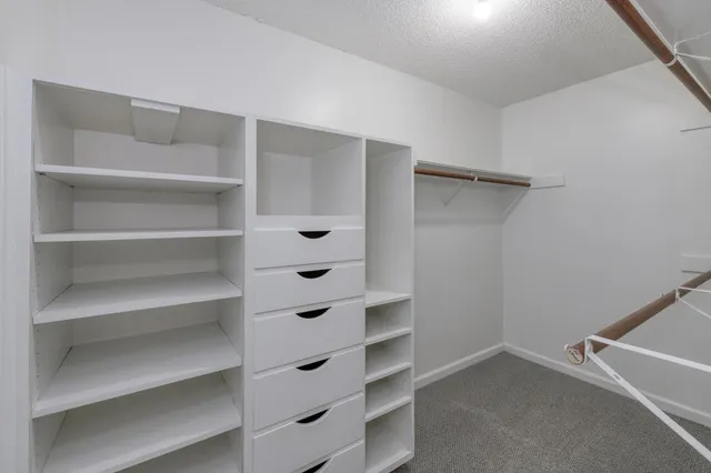 a view of an empty walk in closet