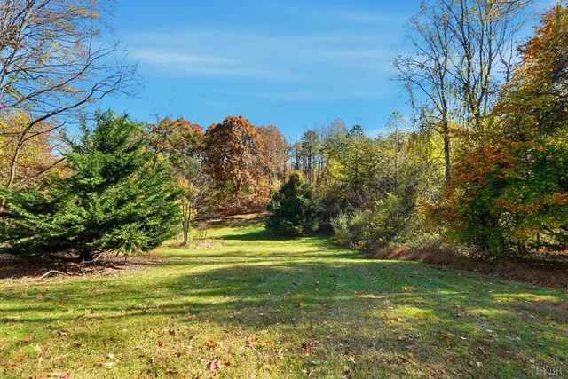 a view of a big yard with a house