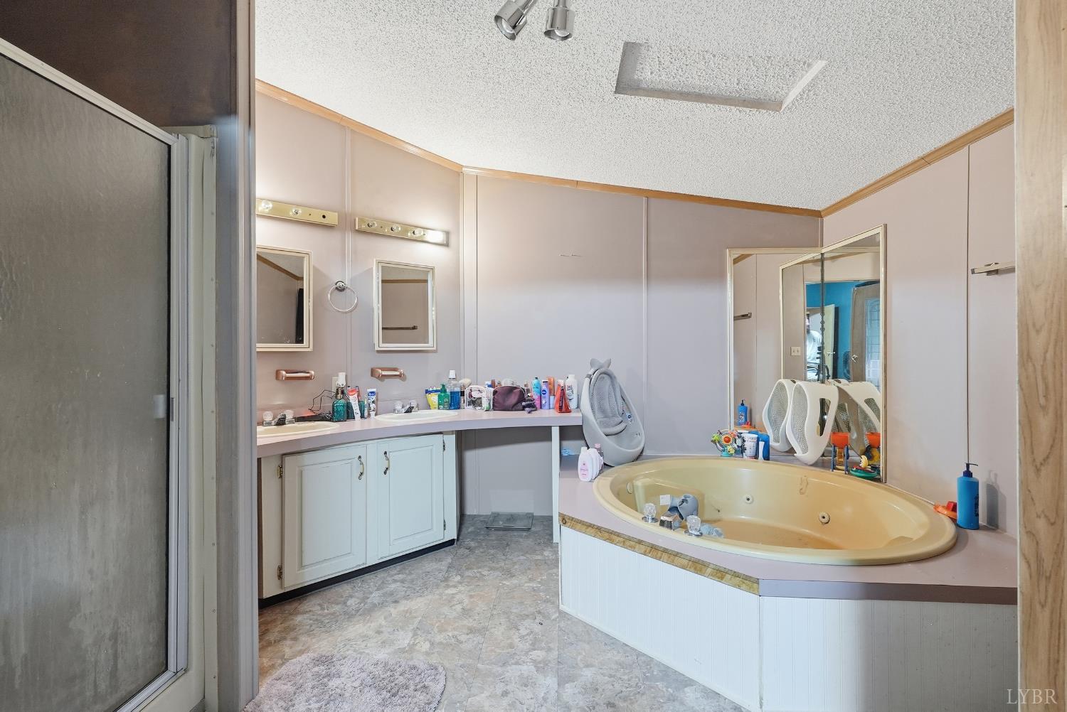 174 Shelter Lane Amherst, VA 24521 - Photo 6 of 29 a bathroom with a tub sink and mirror
