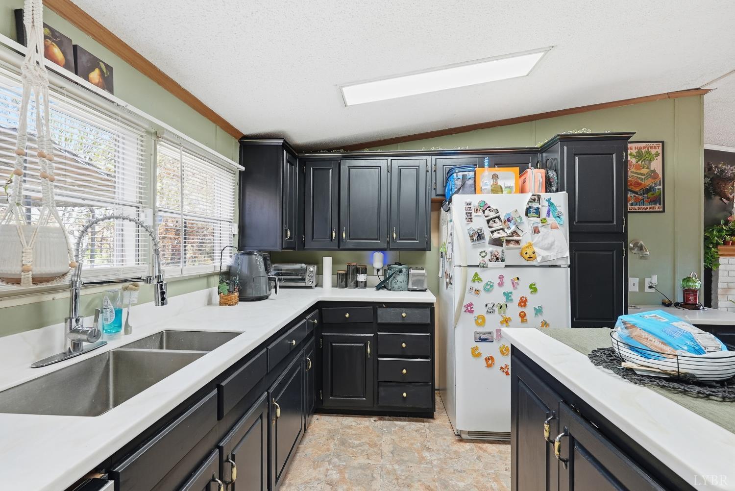 174 Shelter Lane Amherst, VA 24521 - Photo 8 of 29 a kitchen with stainless steel appliances a sink stove and refrigerator