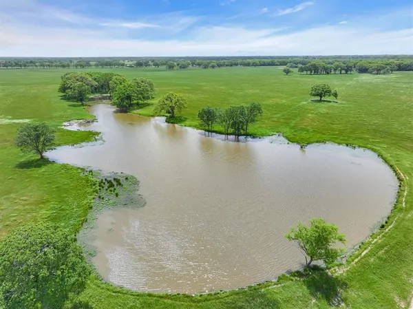 a view of a lake with a yard