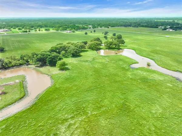 a view of a city with a big yard