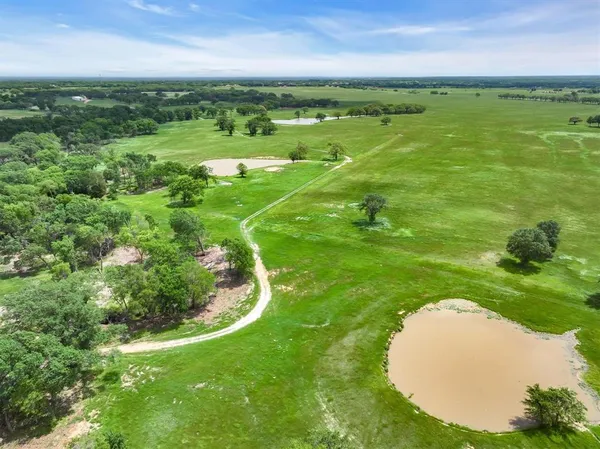 a view of a golf course with a lake