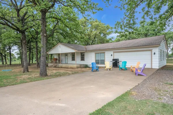 a front view of house with yard and seating area