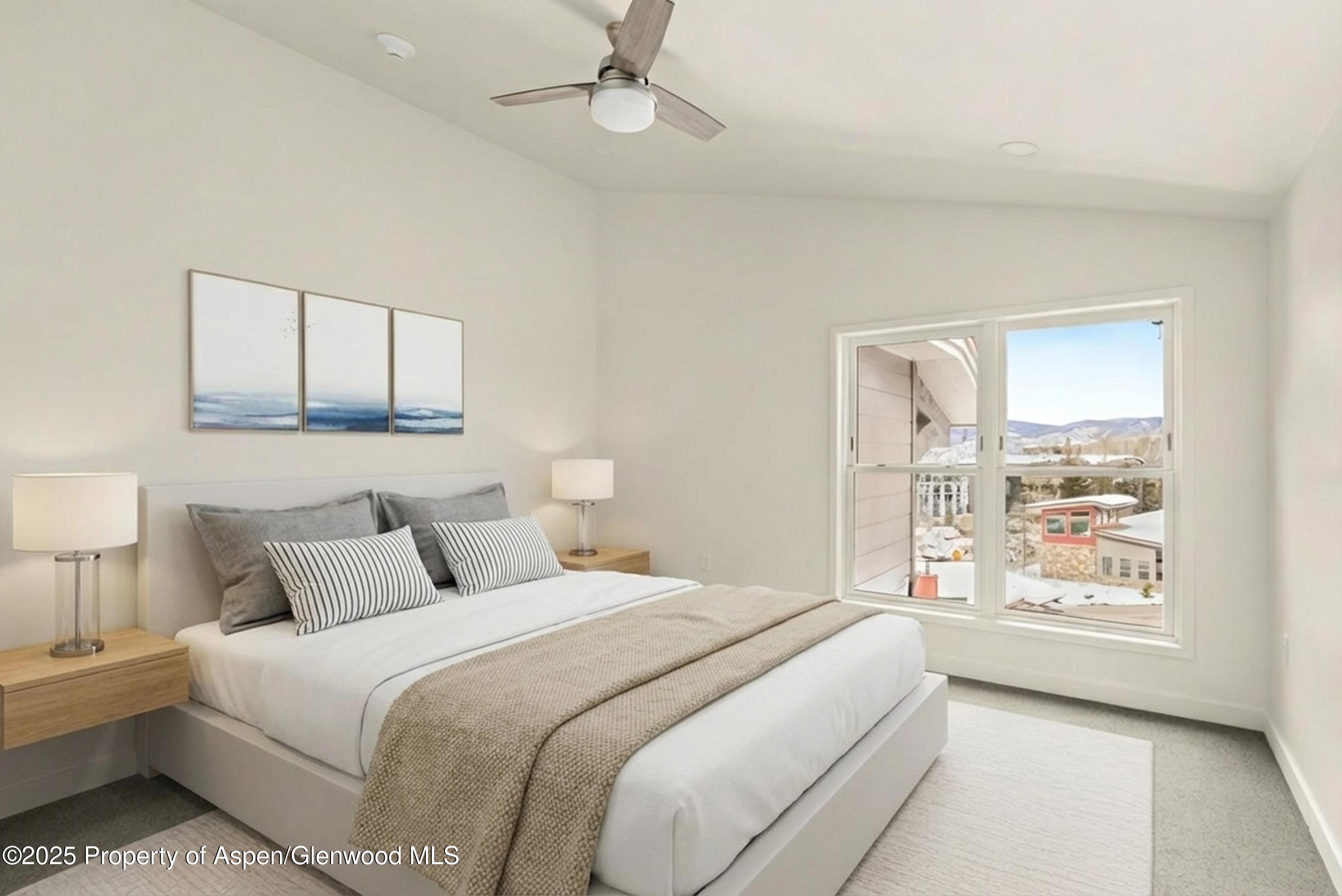 360 Wood Road, Unit 504 Snowmass Village, CO 81615 - Photo 17 of 23 a bedroom with a large bed and a window