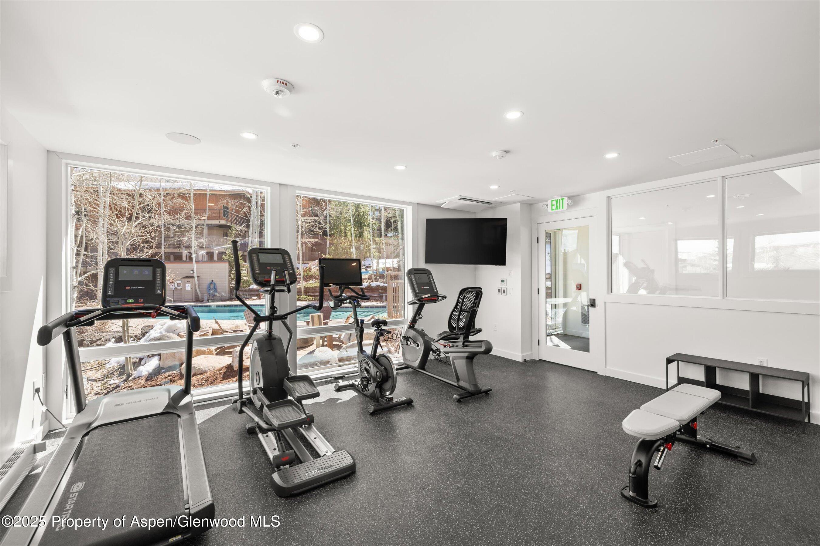 360 Wood Road, Unit 504 Snowmass Village, CO 81615 - Photo 20 of 23 a view of a room with gym equipment