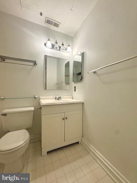 315 New Street, Unit 120 Philadelphia, PA 19106 - Photo 8 of 10 a bathroom with a toilet sink and mirror