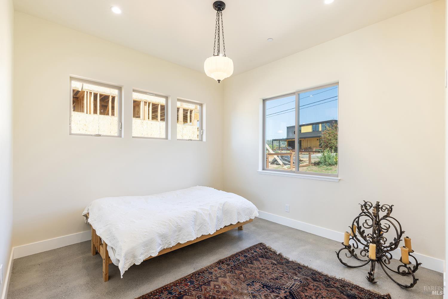 753 Sunnyside Road St. Helena, CA 94574 - Photo 23 of 55 a bedroom with a bed and a window