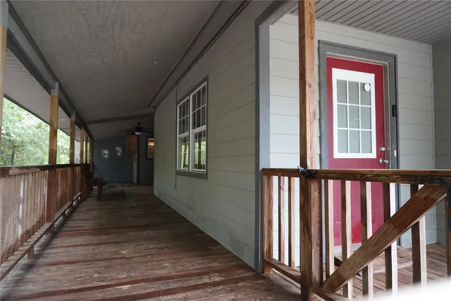 a view of a balcony with wooden floor