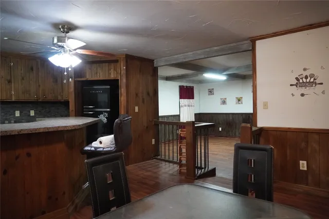 a kitchen with a refrigerator and a sink