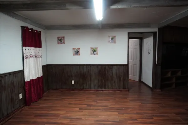 a view of a livingroom with wooden floor