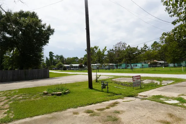 a view of a swimming pool with a yard