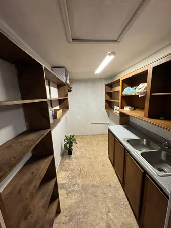 a kitchen with wooden cabinets and a sink