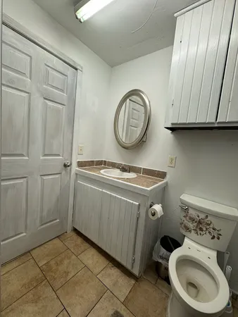 a utility room with a stove a washer and dryer