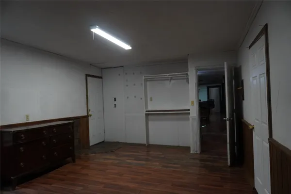 a kitchen with a refrigerator and cabinets