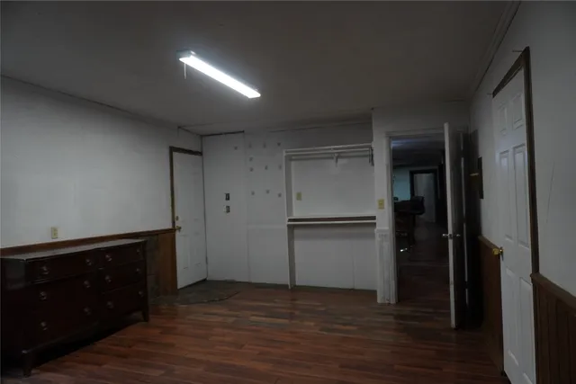 a kitchen with a refrigerator and cabinets