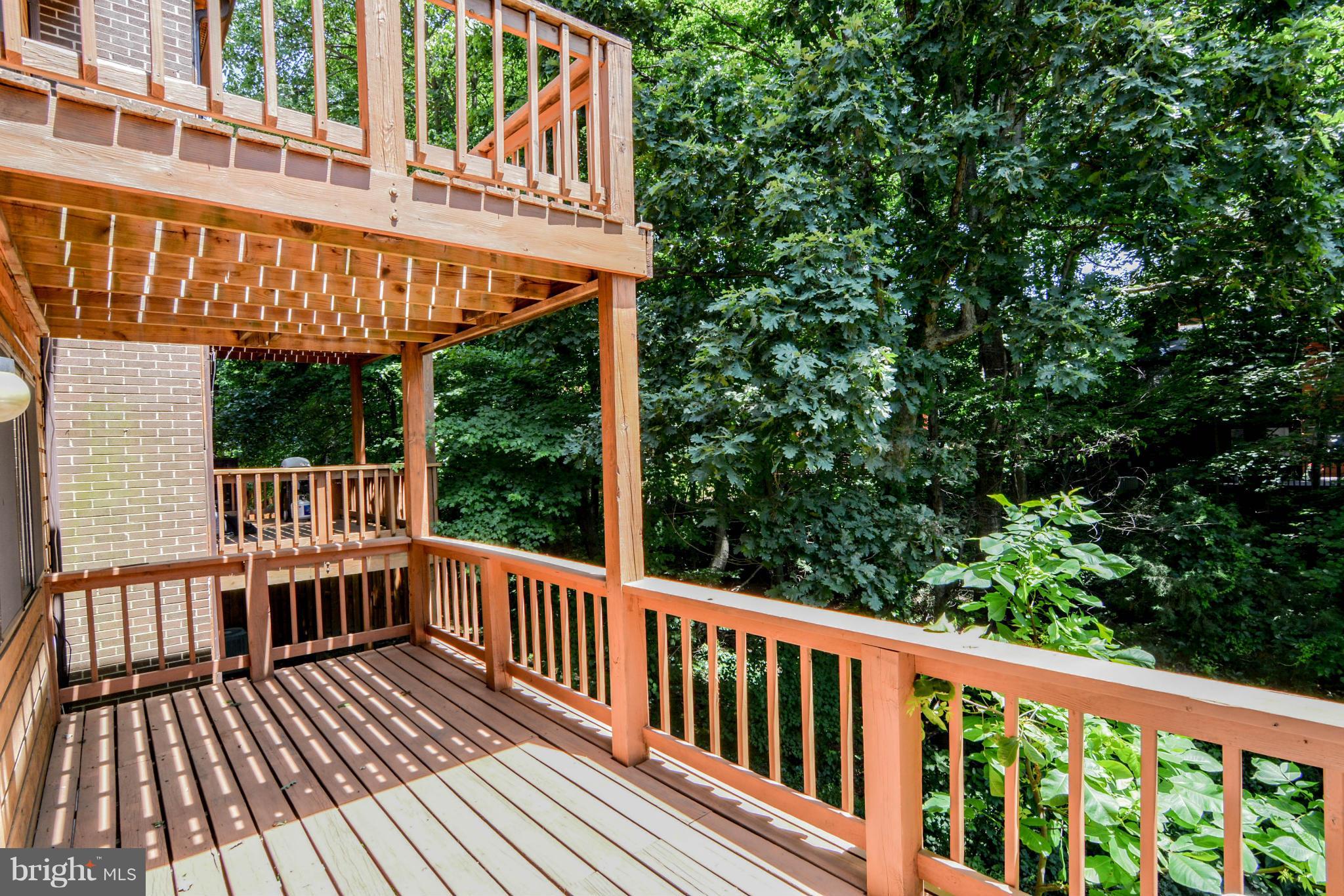 2237 Cedar Cove Court Reston, VA 20191 - Photo 12 of 27 a view of a wooden deck with a large window