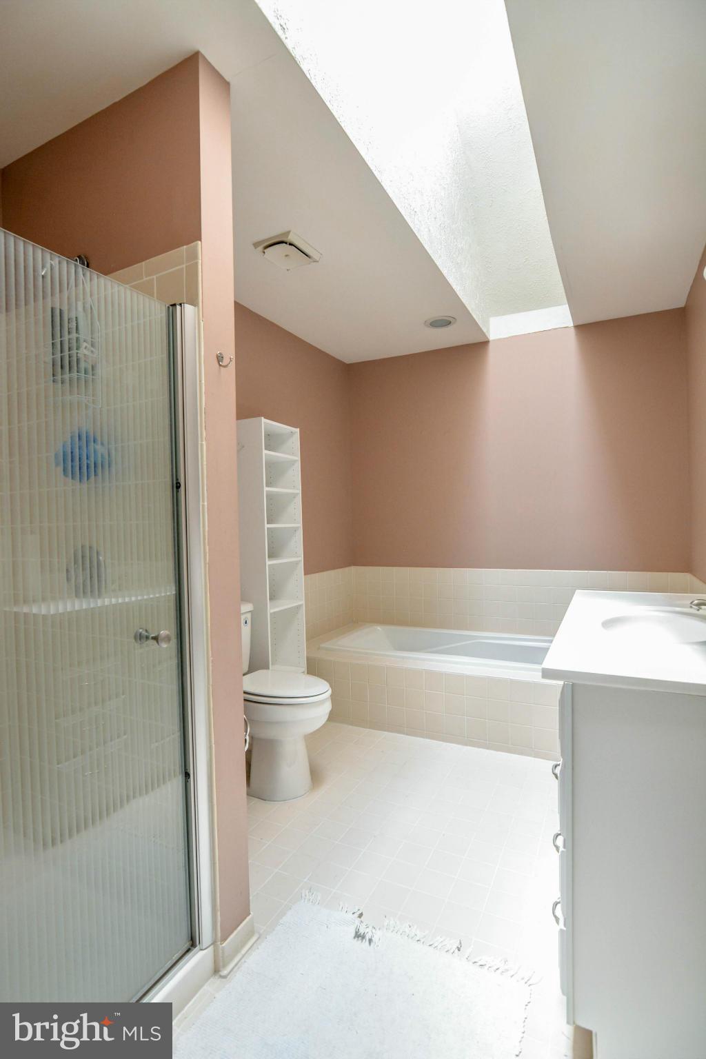 2237 Cedar Cove Court Reston, VA 20191 - Photo 17 of 27 a bathroom with a bathtub and a shower