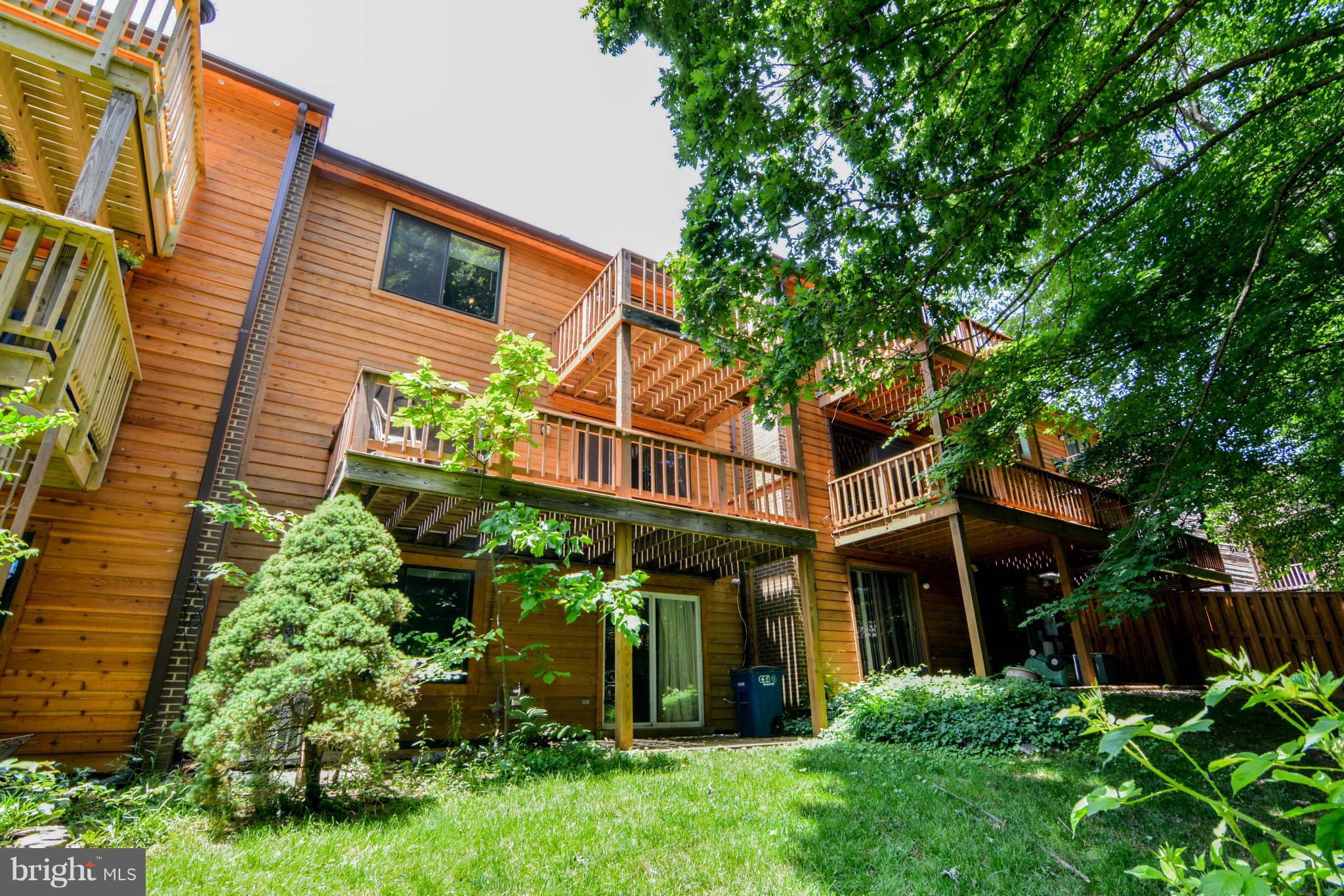 2237 Cedar Cove Court Reston, VA 20191 - Photo 26 of 27 a yellow building with trees in front of it