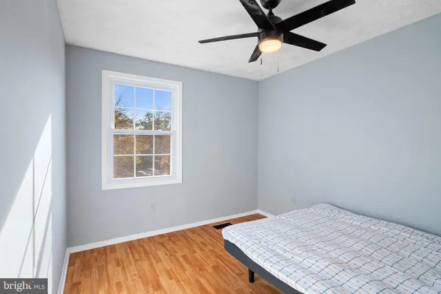 a bedroom with a bed and a table