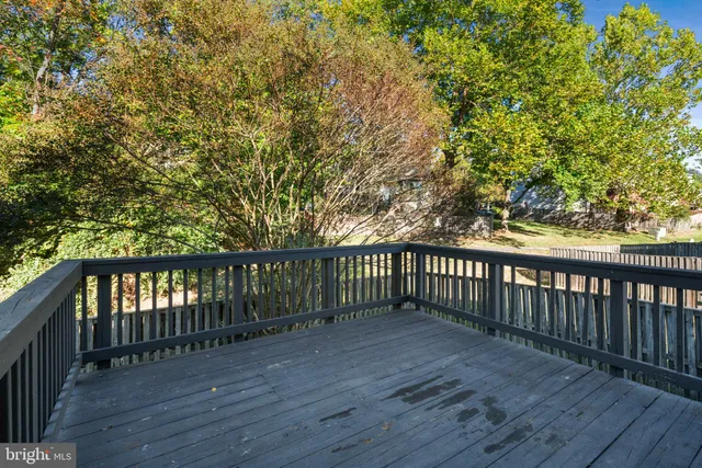 a view of a balcony with wooden floor