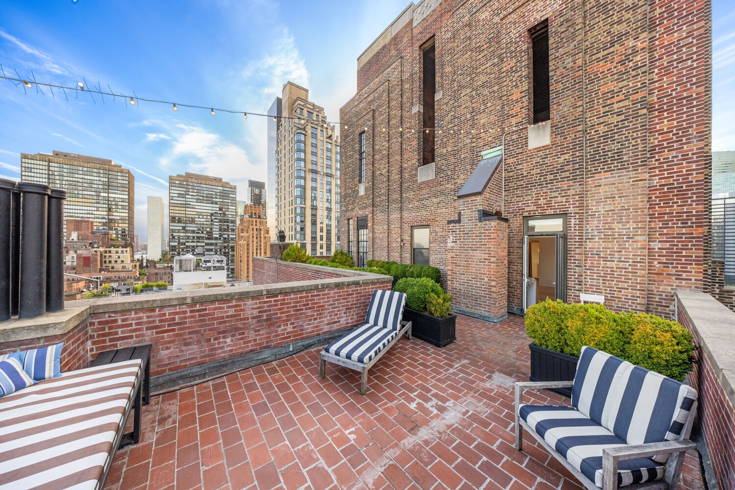 400 East 52nd Street, Unit PHTOWER Manhattan, NY 10022 - Photo 16 of 23 a view of balcony with furniture