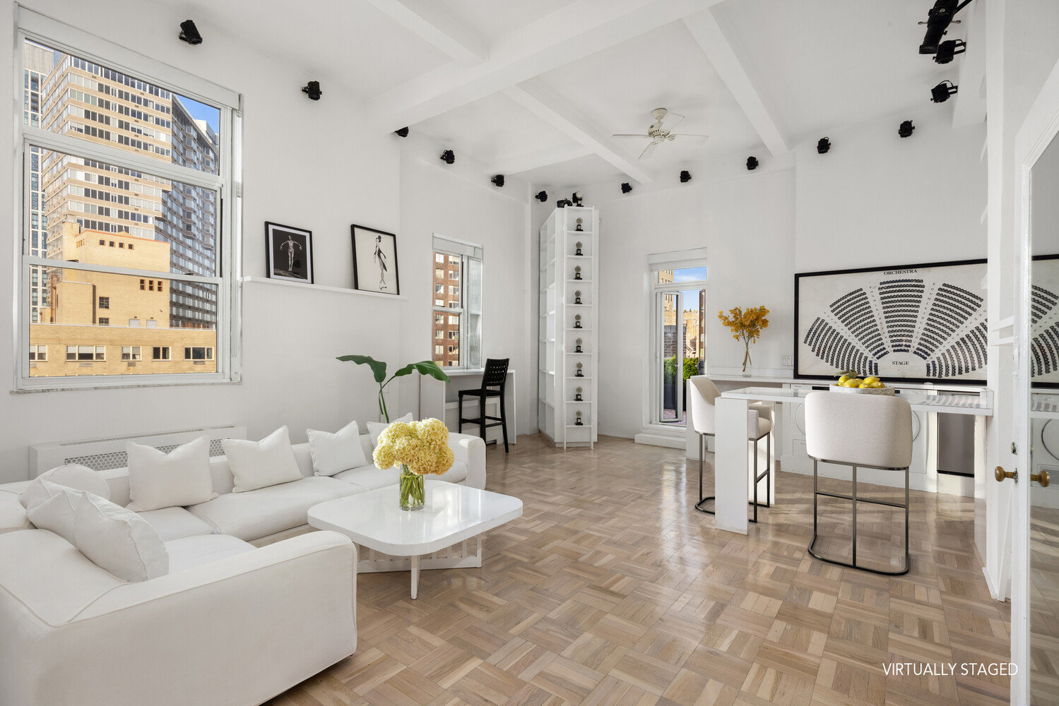 400 East 52nd Street, Unit PHTOWER Manhattan, NY 10022 - Photo 3 of 23 a living room with furniture and wooden floor