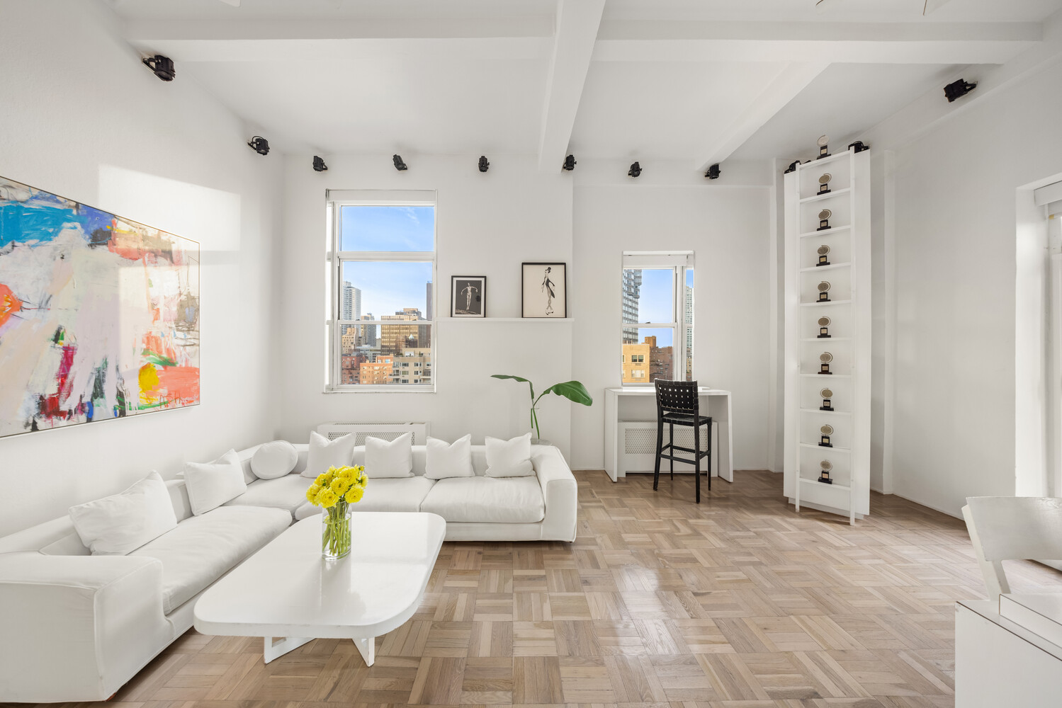400 East 52nd Street, Unit PHTOWER Manhattan, NY 10022 - Photo 4 of 23 a living room with furniture and a couch
