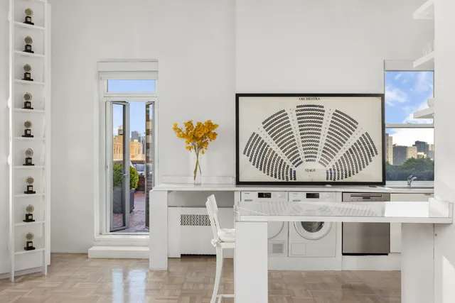 a kitchen with stainless steel appliances granite countertop a sink and a stove