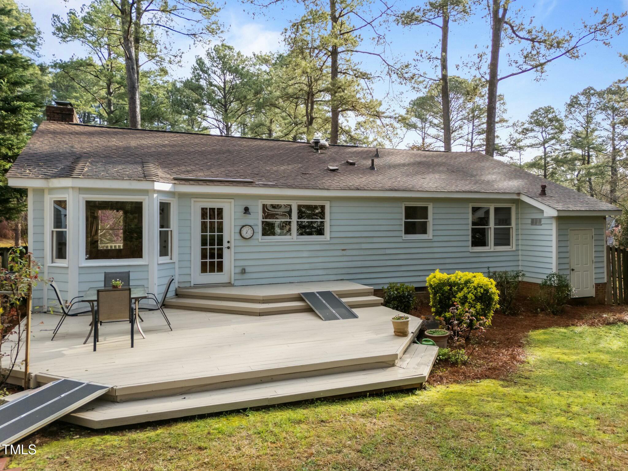 5809 Heatherbrook Circle Raleigh, NC 27612 - Photo 38 of 42 Enjoy entertaining on the large deck. Plenty of space for plants and dining table.