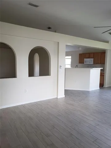 a view of a kitchen with a dishwasher and a microwave