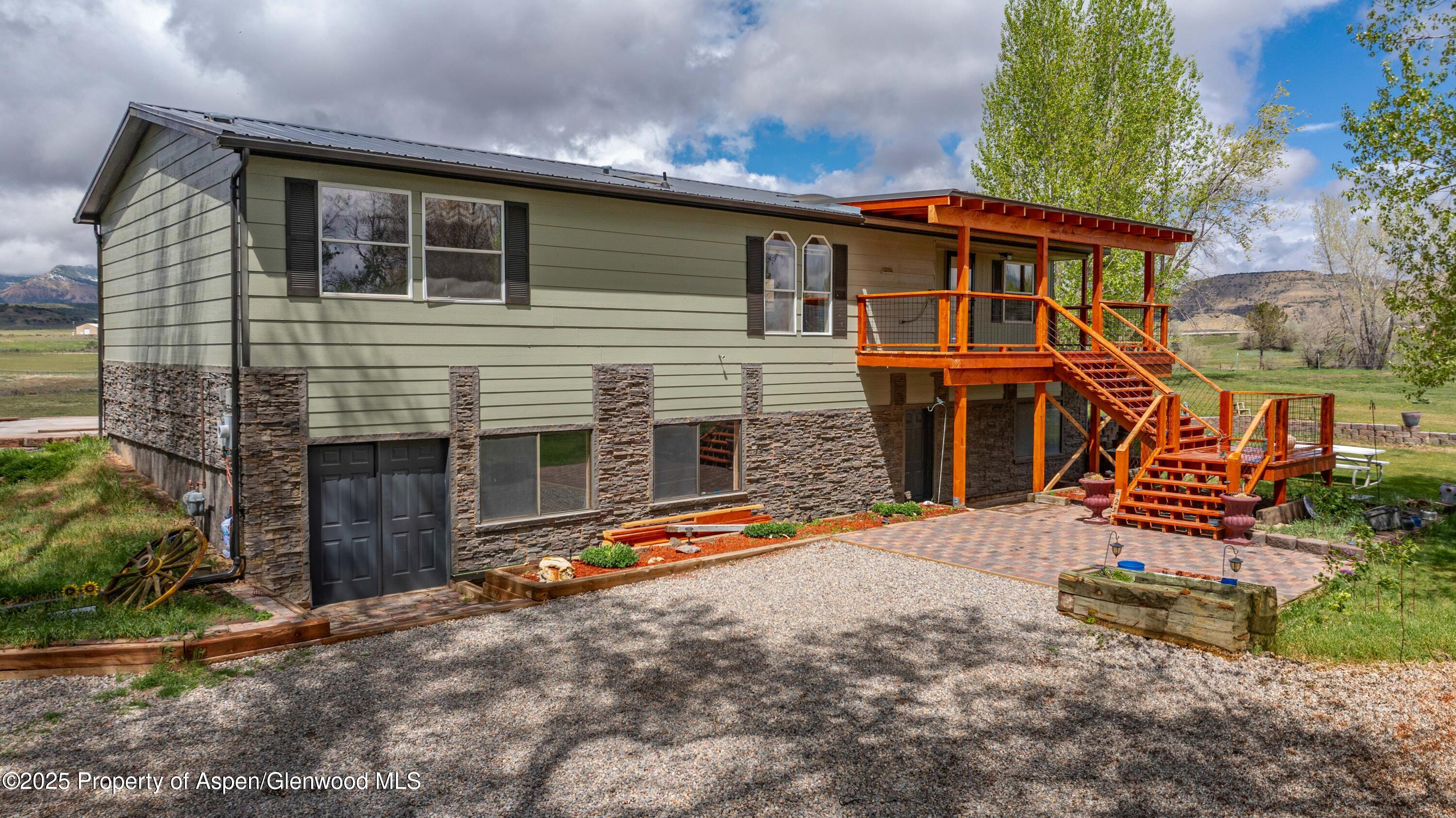 233 County Road 265 Rifle, CO 81650 - Photo 1 of 35 a front view of a house with a yard