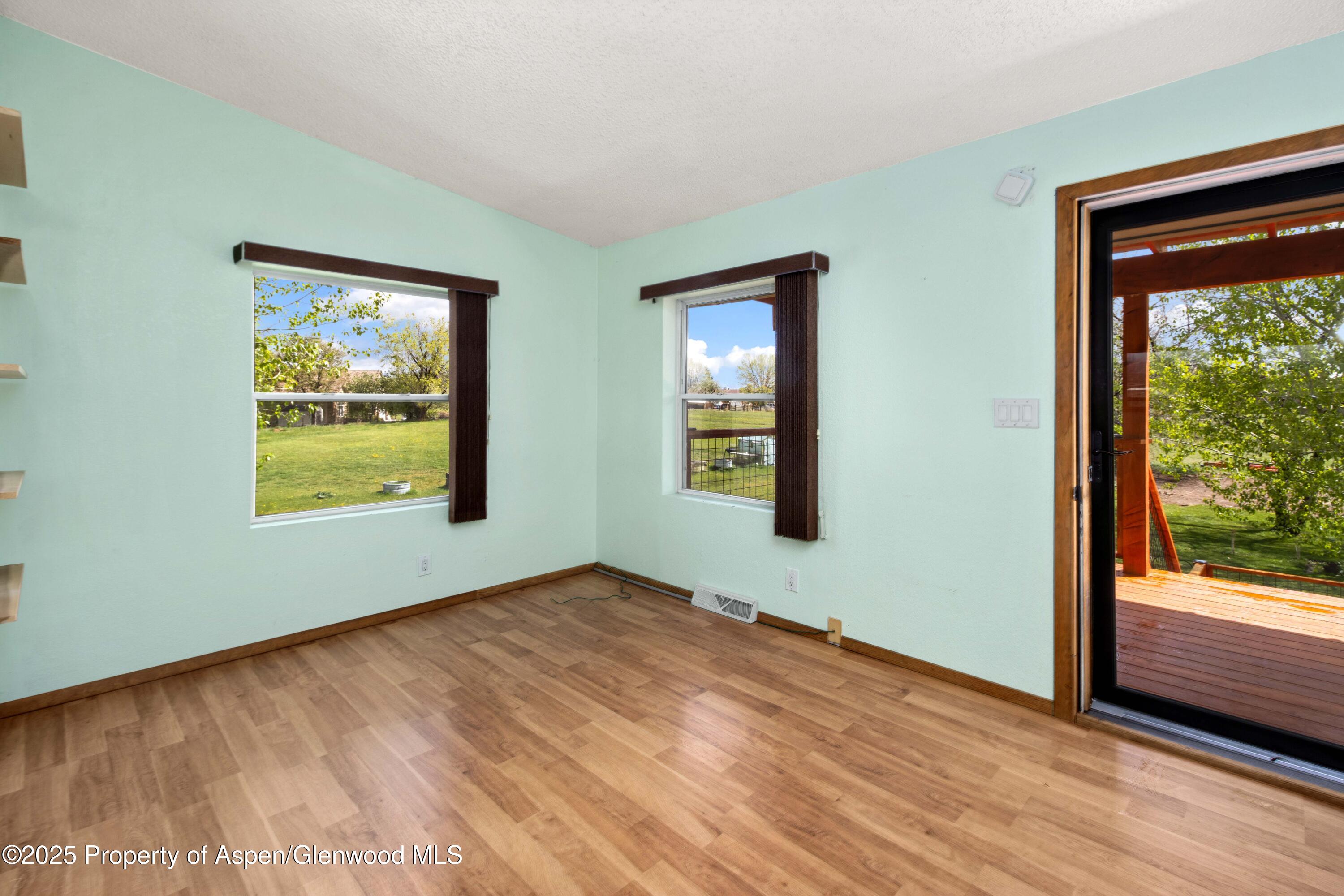 233 County Road 265 Rifle, CO 81650 - Photo 16 of 35 wooden floor in an empty room with a window