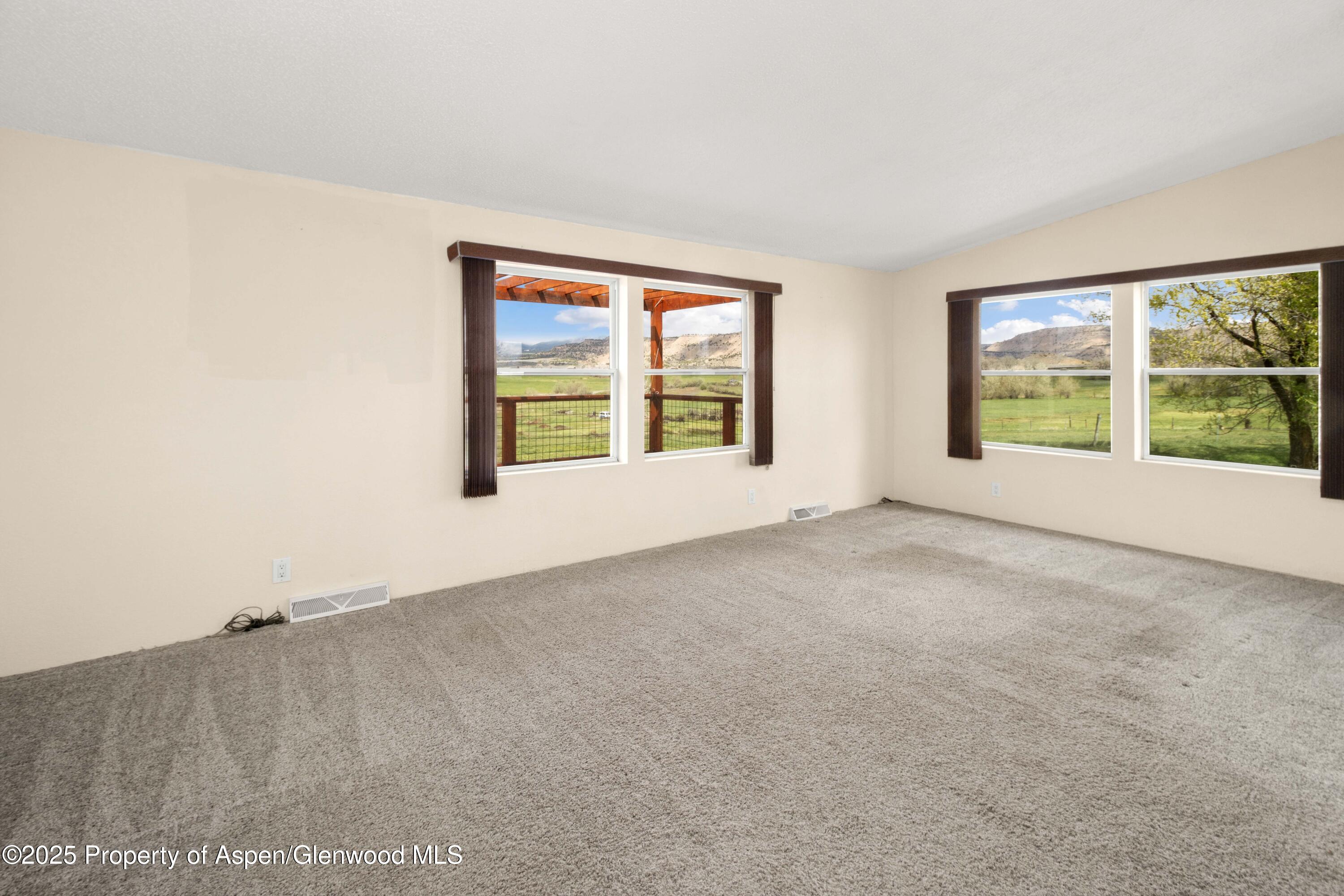 233 County Road 265 Rifle, CO 81650 - Photo 18 of 35 an empty room with windows