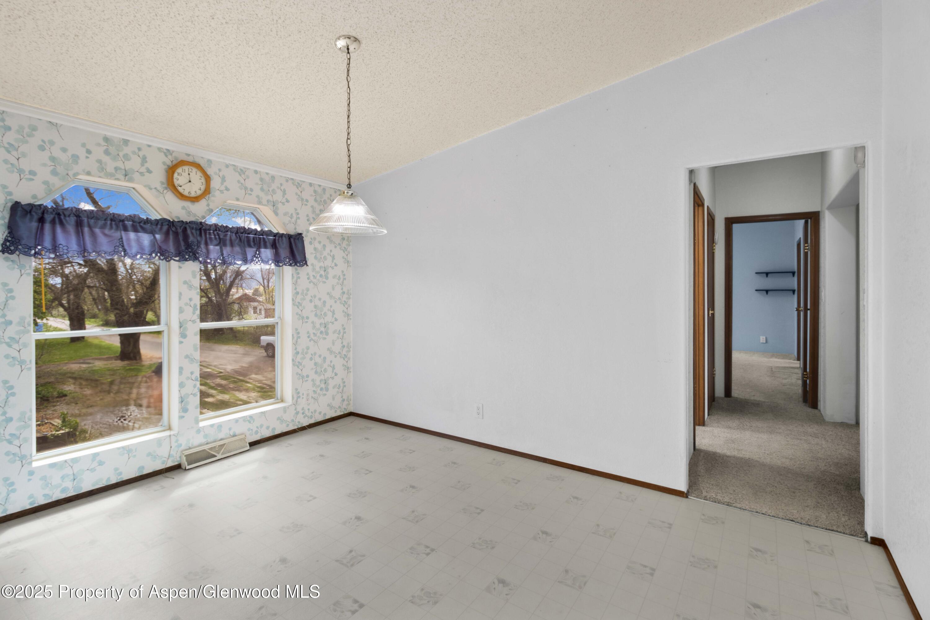 233 County Road 265 Rifle, CO 81650 - Photo 23 of 35 a view of a room with wooden floor and windows