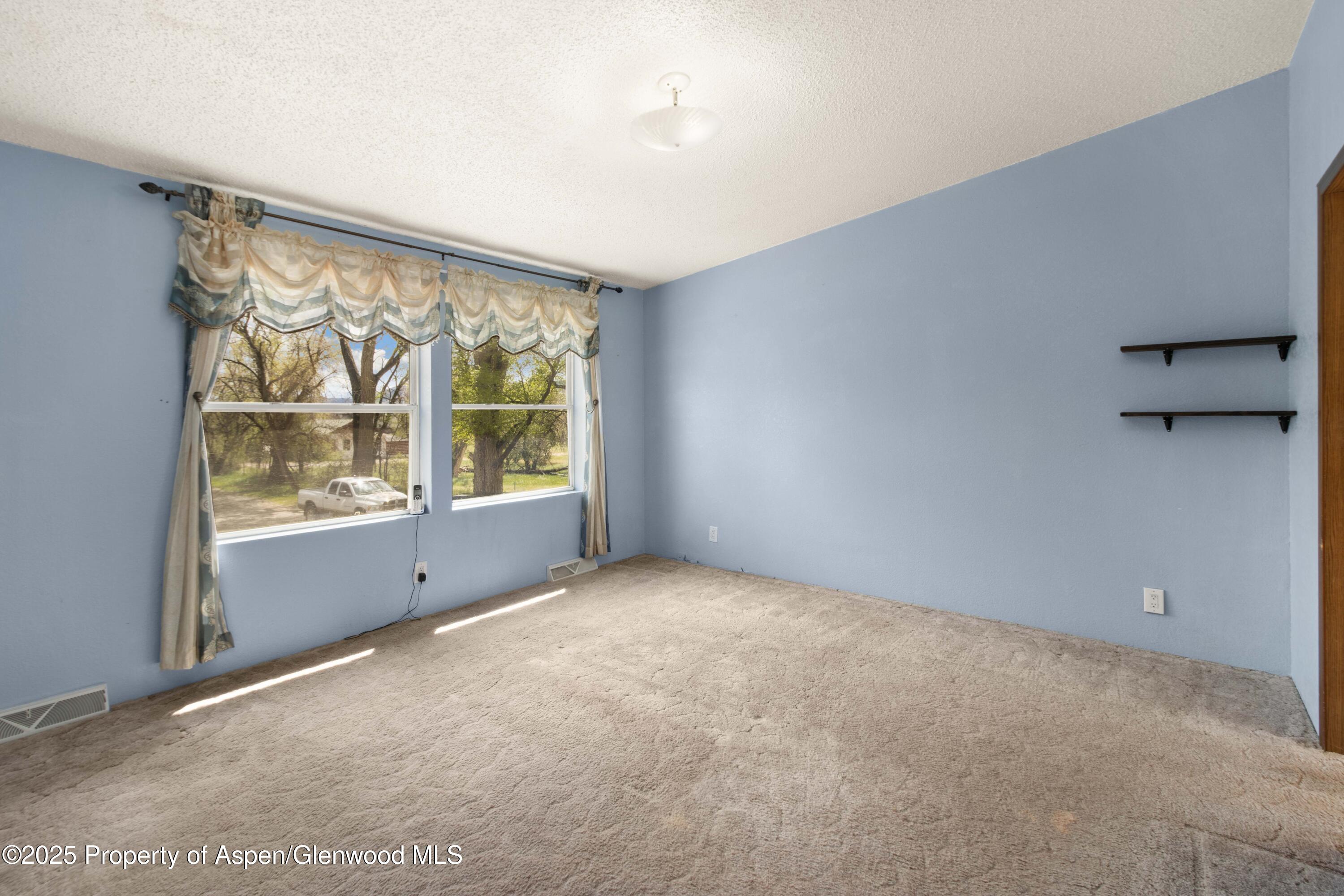 233 County Road 265 Rifle, CO 81650 - Photo 29 of 35 a view of an empty room with a window