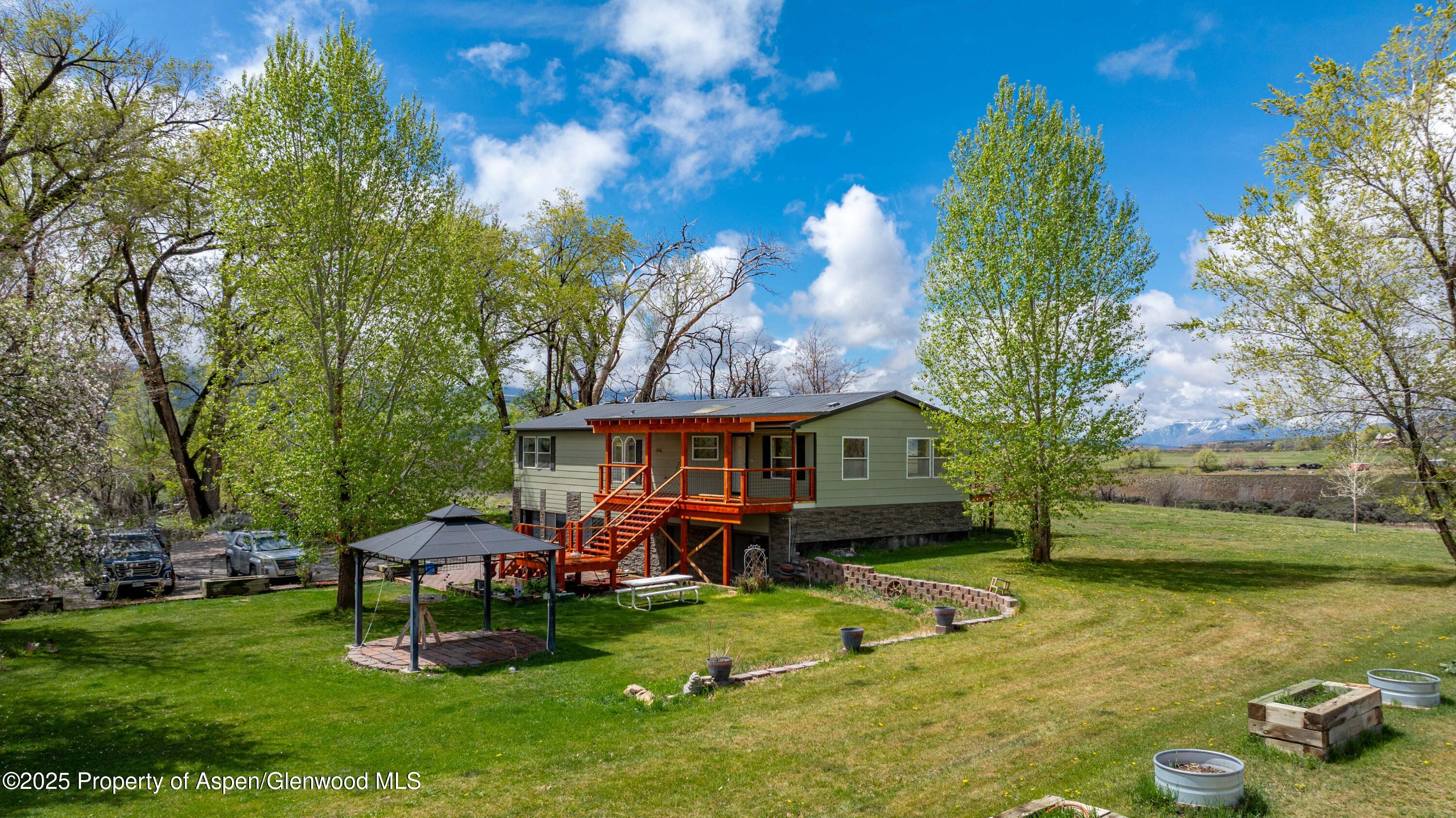 233 County Road 265 Rifle, CO 81650 - Photo 4 of 35 a view of a house with a yard