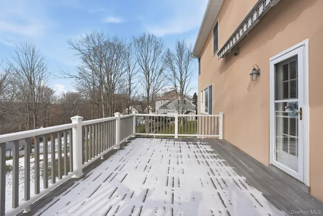 a view of a house with backyard and wooden floor