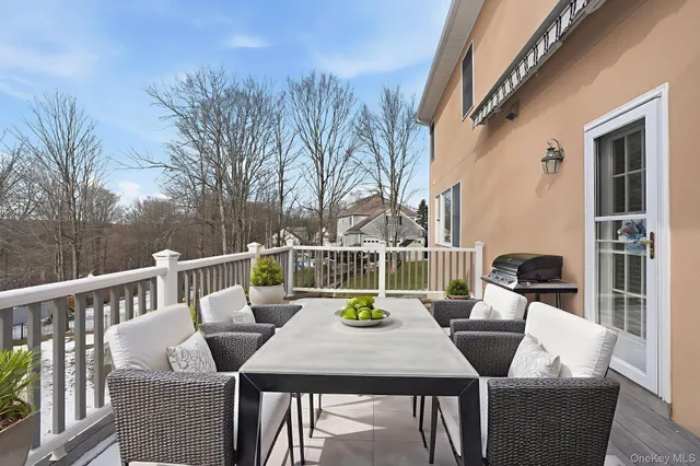 a view of a patio with iron fence